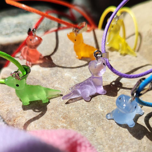 Colliers dinosaure fluorescents dans le noir, 6 modèles différents