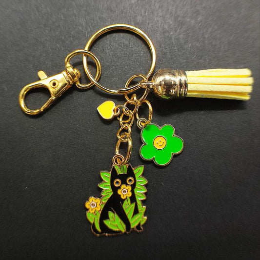 Porte-Clé "Chat Noir dans les Hautes Herbes et Fleurs Jaunes"