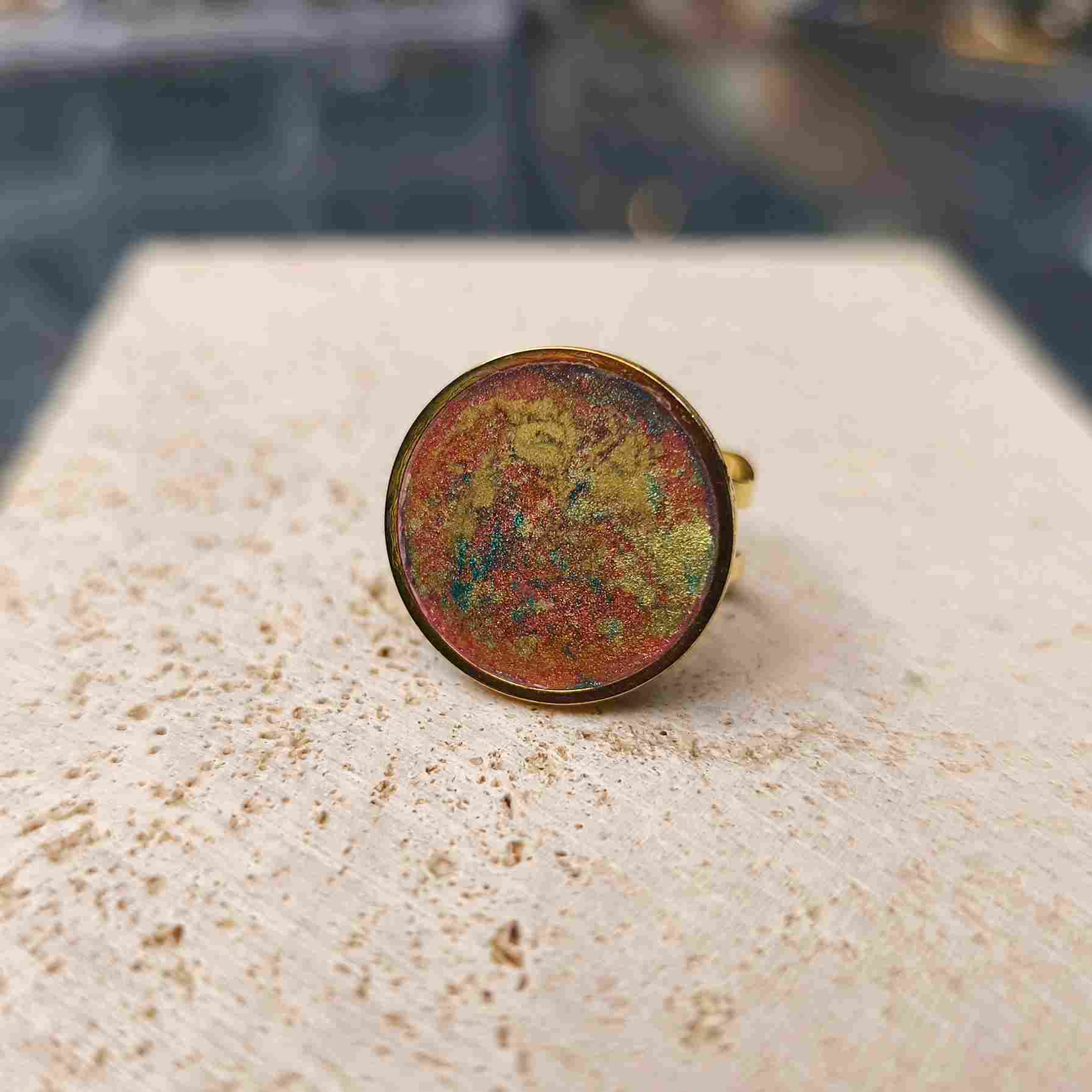 Bague ronde 20 mm orange et turquoise avec poudre d'or