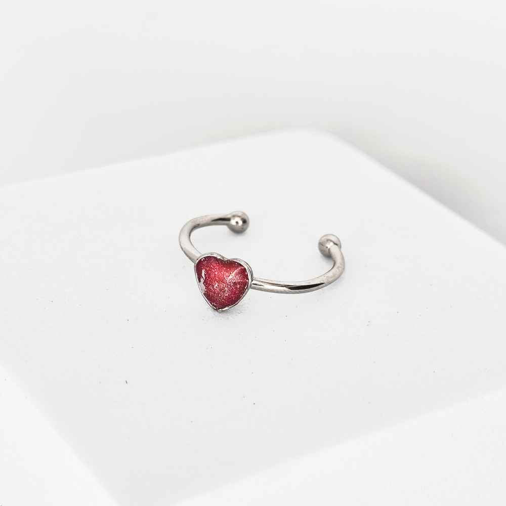 Bijou artisanal rouge poudré avec reflets argentés Volcan Latent