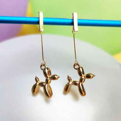 Boucles d'oreilles chien ballon dorées 