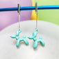Boucles d'oreilles chien ballon argentées turquoise clair vue 3