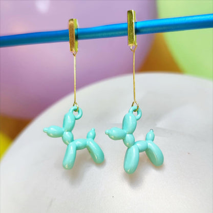 Boucles d'oreilles chien ballon dorées turquoise clair vue 1
