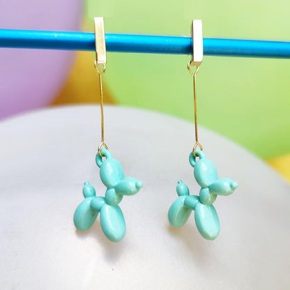 Boucles d'oreilles chien ballon dorées turquoise clair vue 2
