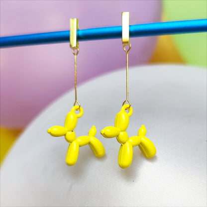 Boucles d'oreilles chien ballon dorées jaune vue 1