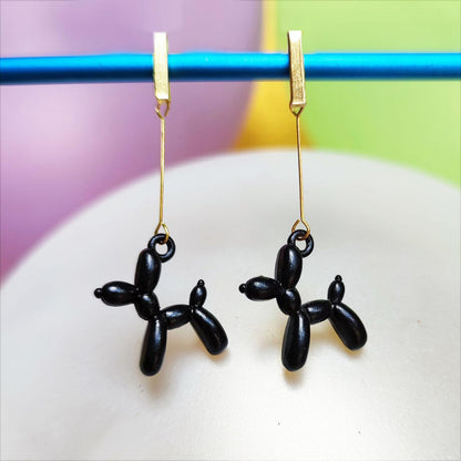 Boucles d'oreilles chien ballon noir dorées vue 1