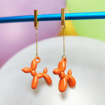 Boucles d'oreilles chien ballon dorées orange vue 1