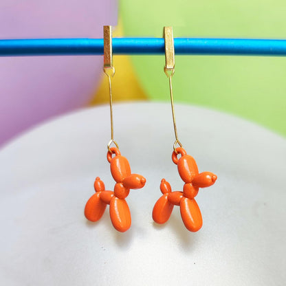 Boucles d'oreilles chien ballon dorées orange vue 2