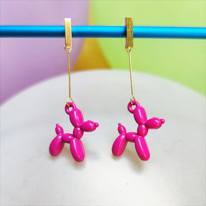 Boucles d'oreilles chien ballon dorées rose foncé vue 1