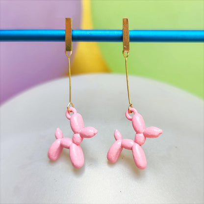 Boucles d'oreilles chien ballon dorées rose vue 2