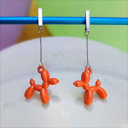 Boucles d'oreilles chien ballon argentées orange vue 1