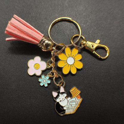 fiche produit Porte-Clé Chat Noir et Blanc avec Lampe et Fleurs pompon rose