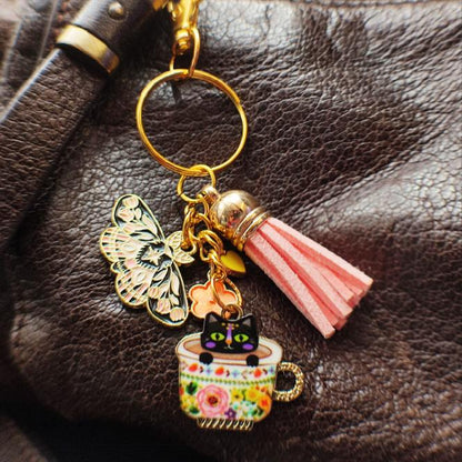 Porte-Clé "Chat Noir dans Tasse de Thé Fleurie" avec Papillon vue 2 sac cuir marron