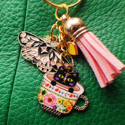 Porte-Clé "Chat Noir dans Tasse de Thé Fleurie" avec Papillon vue 3 sac cuir vert